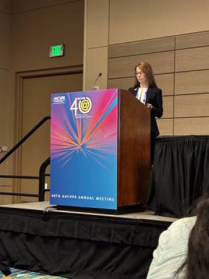 Woman presenting at a podium
